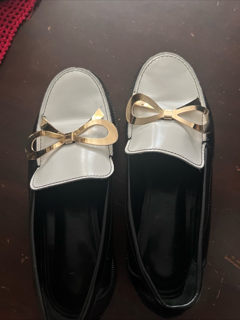 Two-Tone Black and White Loafers with Gold Bow Accent